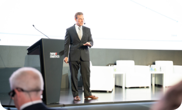 Mike Debnar speaking at EXP KSA 2025 about customer-centric transformation and data-driven growth.