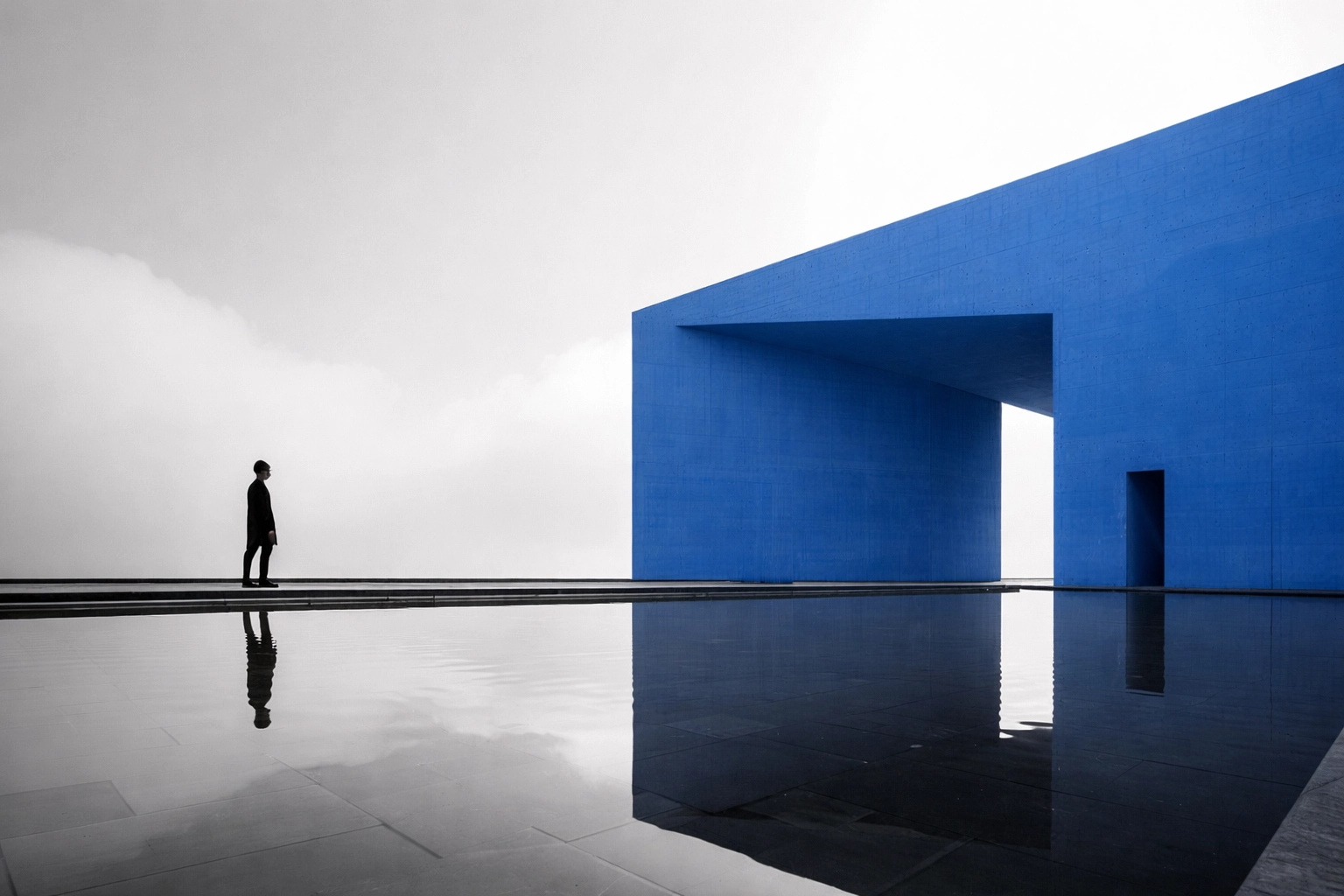 Person approaching modern structure symbolizing connection, collaboration, and starting a business transformation journey